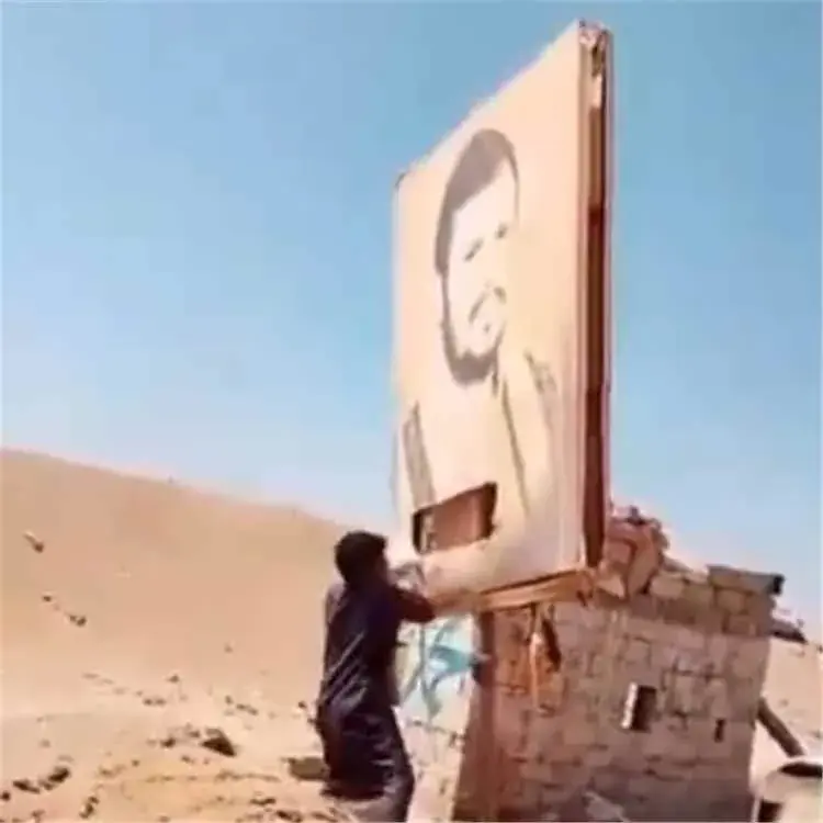 صور الحوثي تحت أقدام الجيش عقب سقوط مواقعه